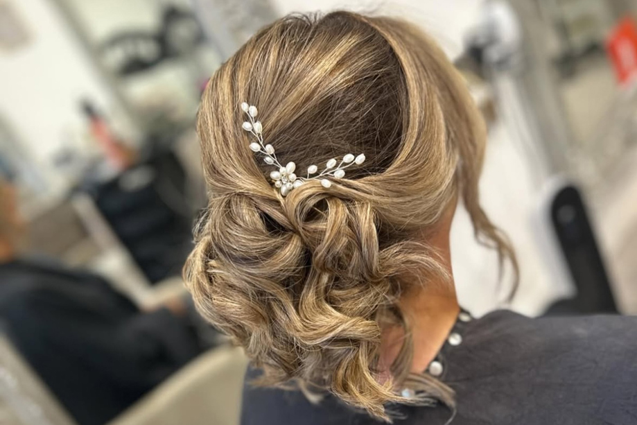 Curly updo with hair accessory